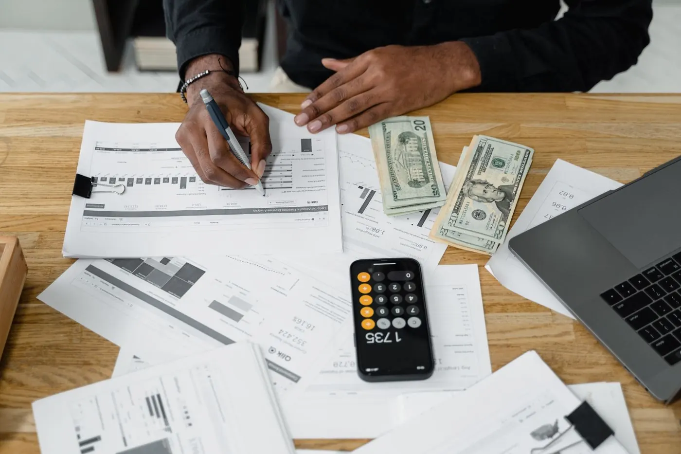 An accountant reviewing the books at a desk