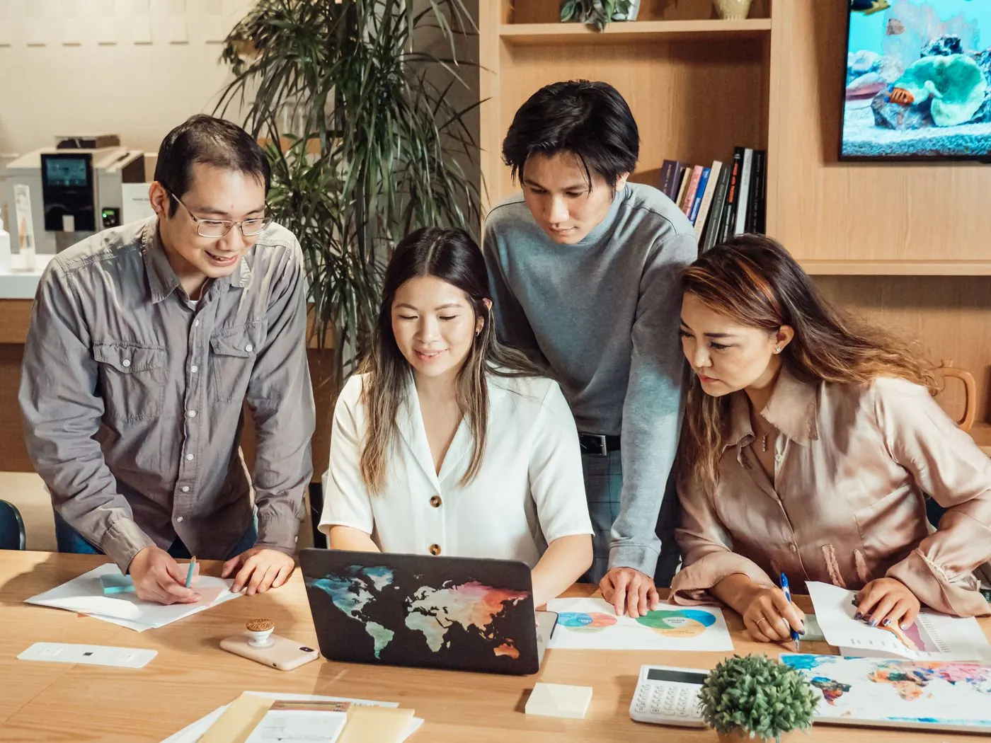 A small team working together around a table