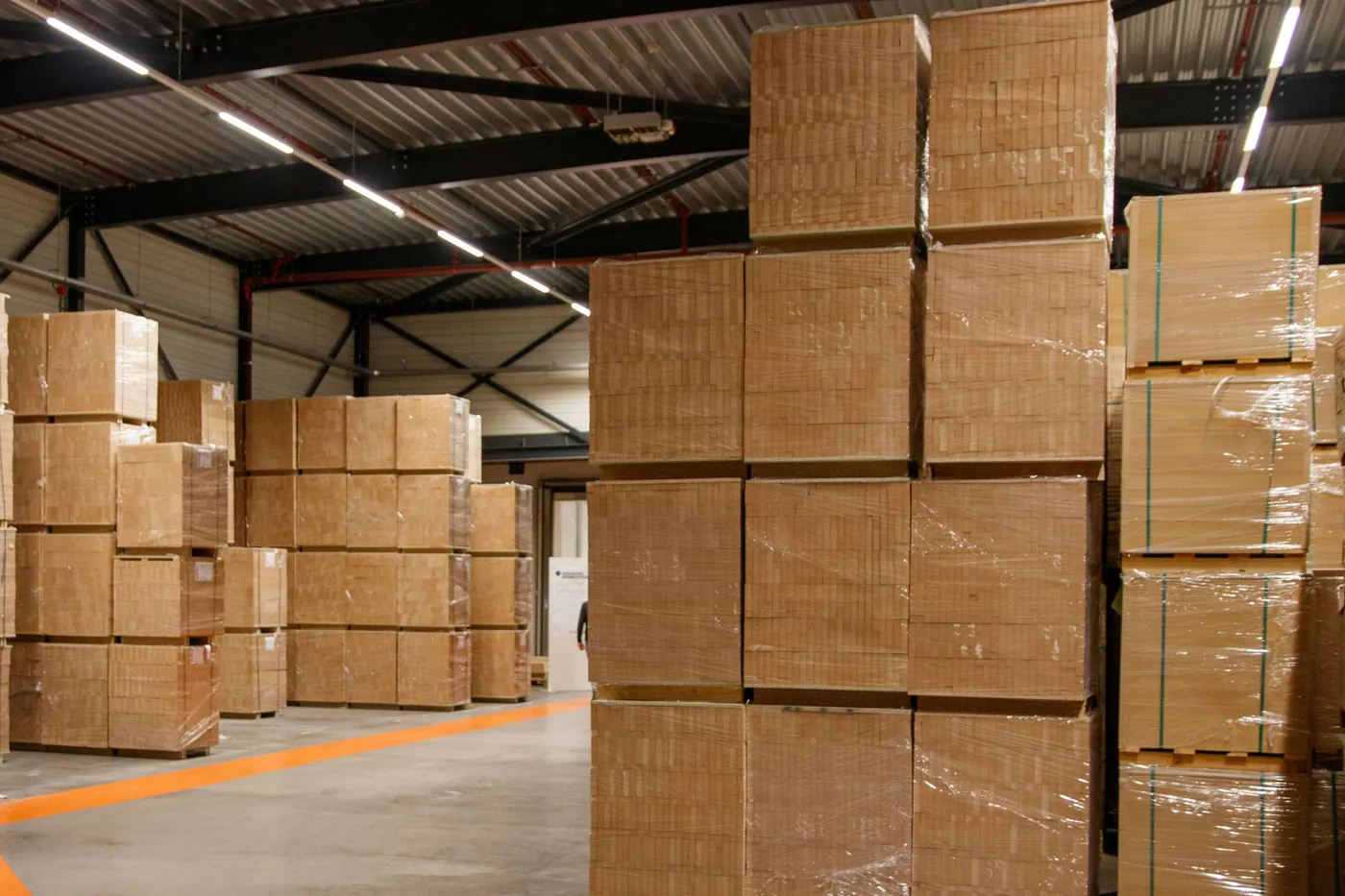 Sacks and cartons stacked in a trader's godown