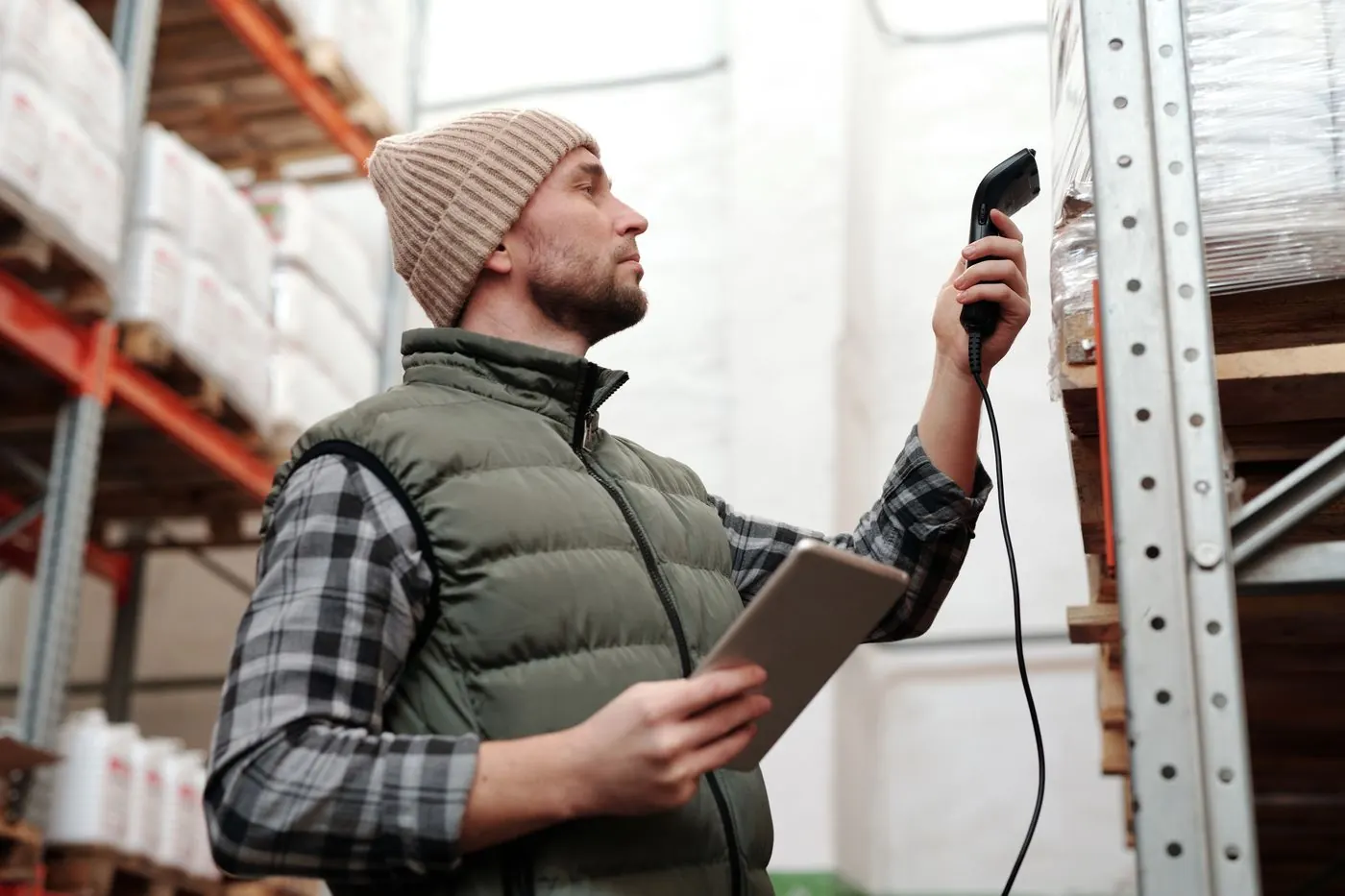 A worker scanning stock in a warehouse